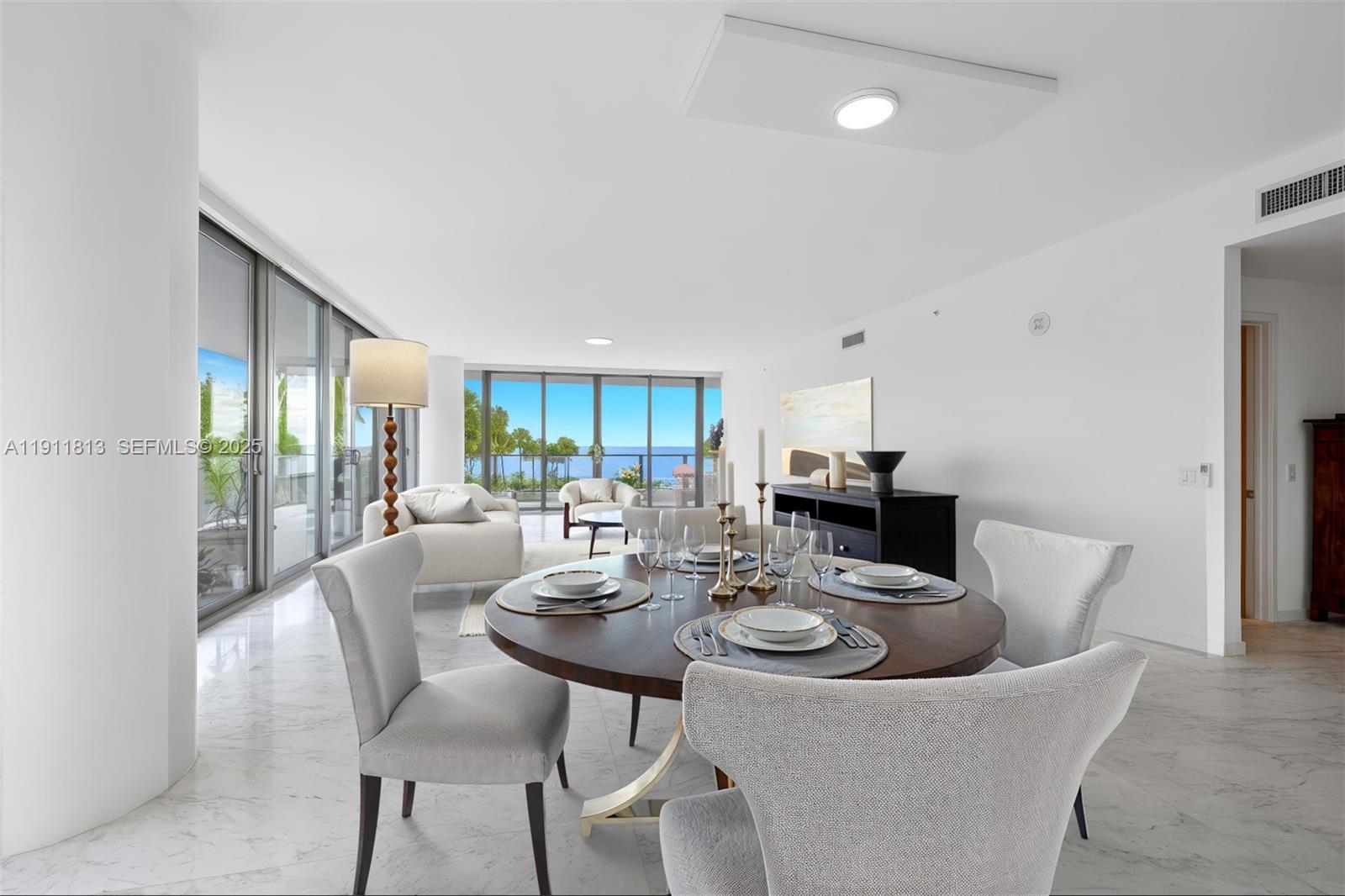 350 Ocean Drive, Unit 301N Key Biscayne, FL 33149 - Photo 23 of 41 a view of a dining room with furniture and wooden floor