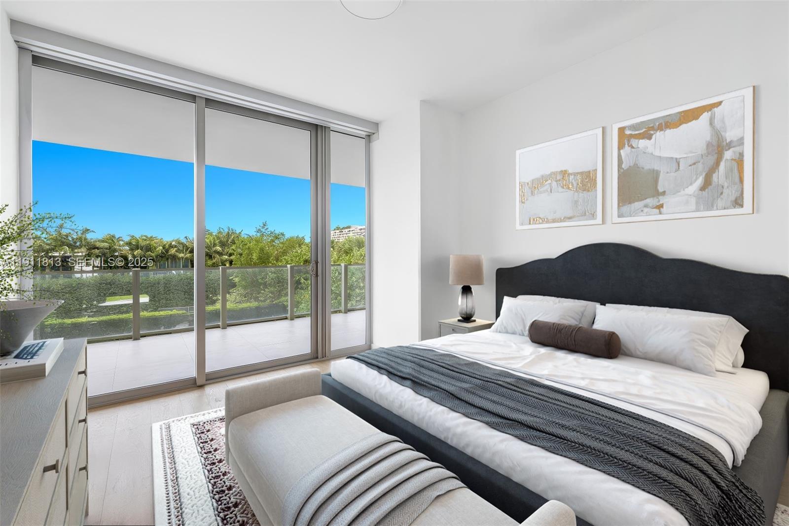 350 Ocean Drive, Unit 301N Key Biscayne, FL 33149 - Photo 28 of 41 a bedroom with a large bed and a large window