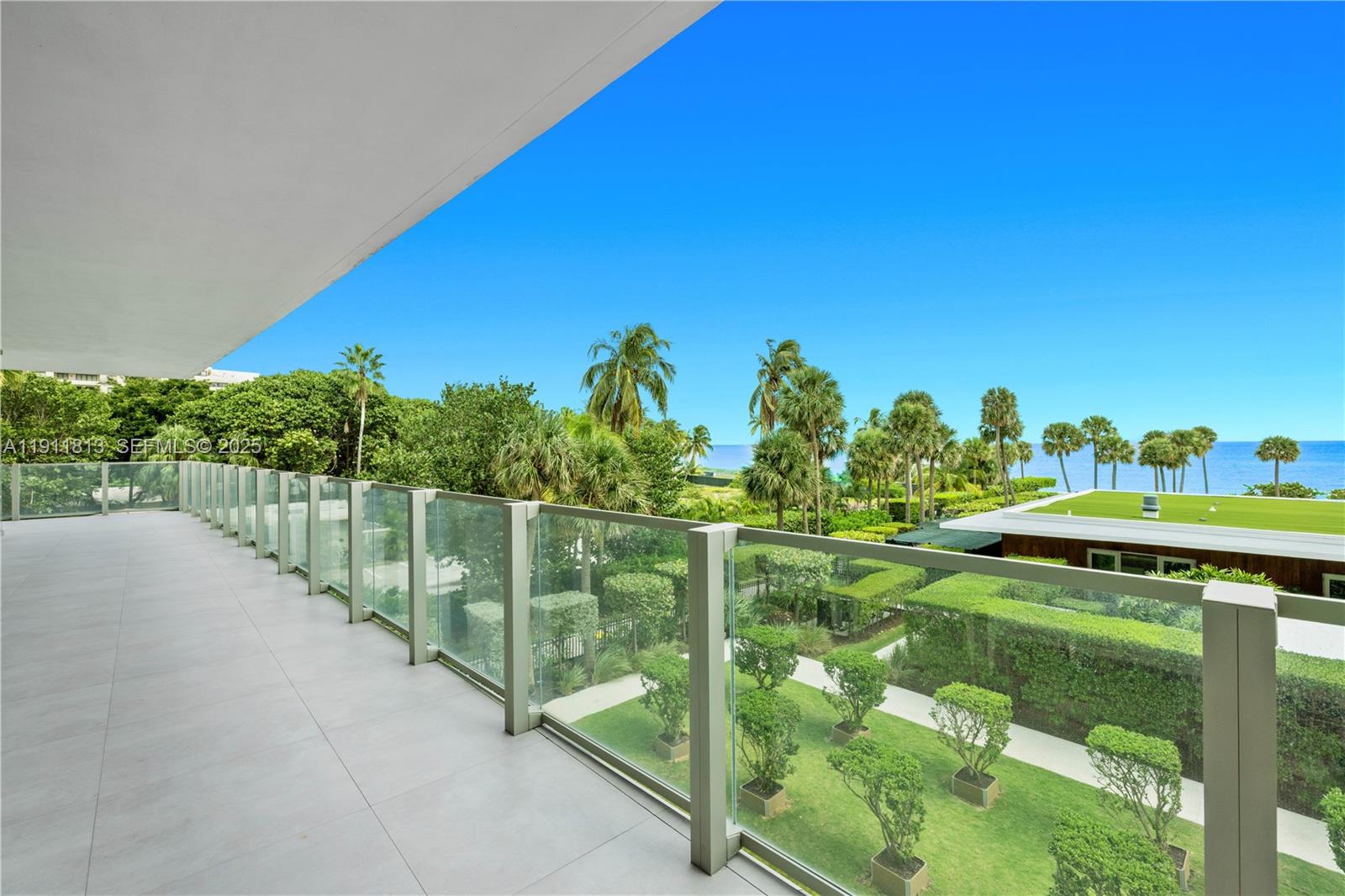 350 Ocean Drive, Unit 301N Key Biscayne, FL 33149 - Photo 30 of 41 a view of a lawn chairs and iron fence