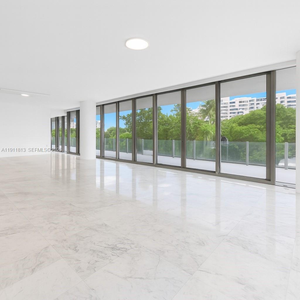 350 Ocean Drive, Unit 301N Key Biscayne, FL 33149 - Photo 5 of 41 a view of an empty room with a sliding door