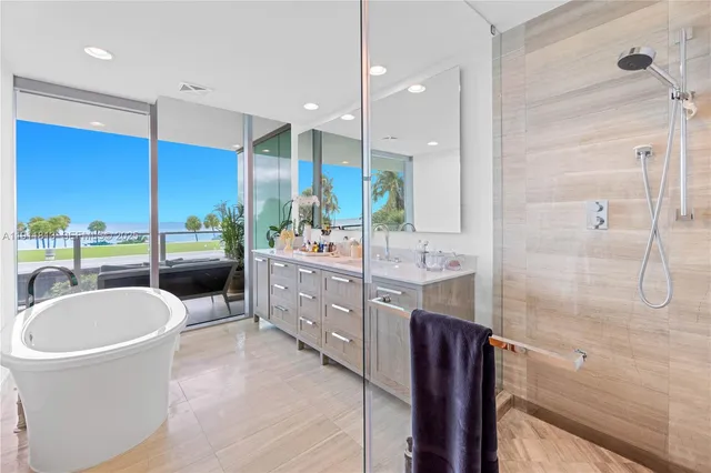 a bathroom with a double vanity sink a mirror and a shower