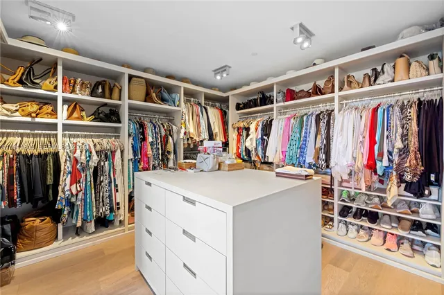 a view of a living room with clothes and shoes