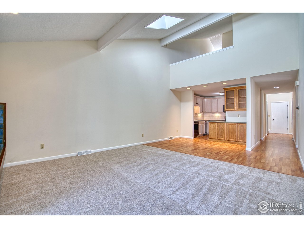 1925 28th Avenue, Unit 30 Greeley, CO 80634 - Photo 12 of 34 a view of empty room with wooden floor