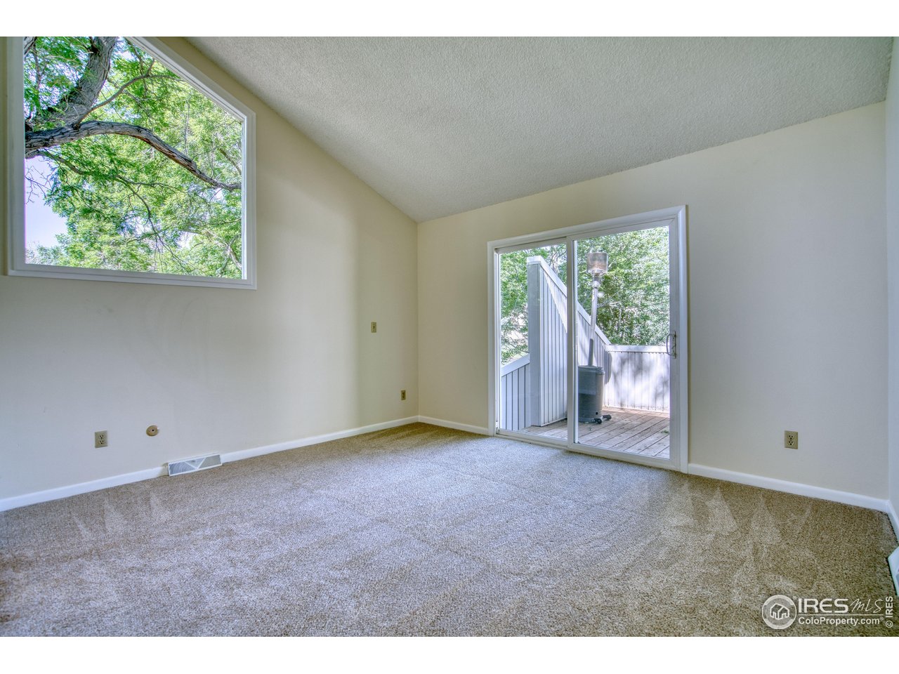 1925 28th Avenue, Unit 30 Greeley, CO 80634 - Photo 20 of 34 a view of an empty room with a window