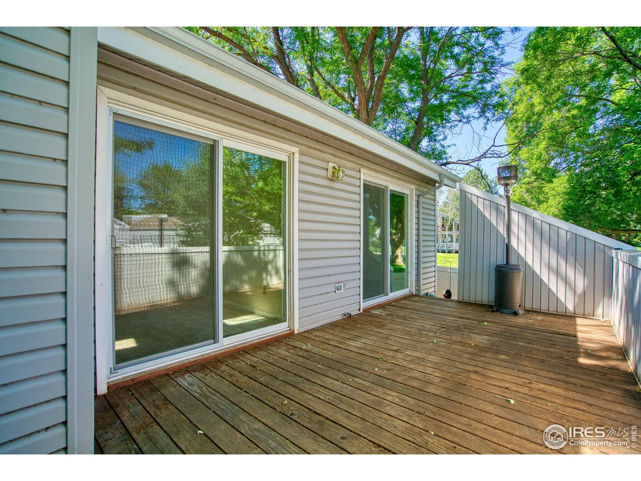 1925 28th Avenue, Unit 30 Greeley, CO 80634 - Photo 22 of 34 a view of backyard and deck