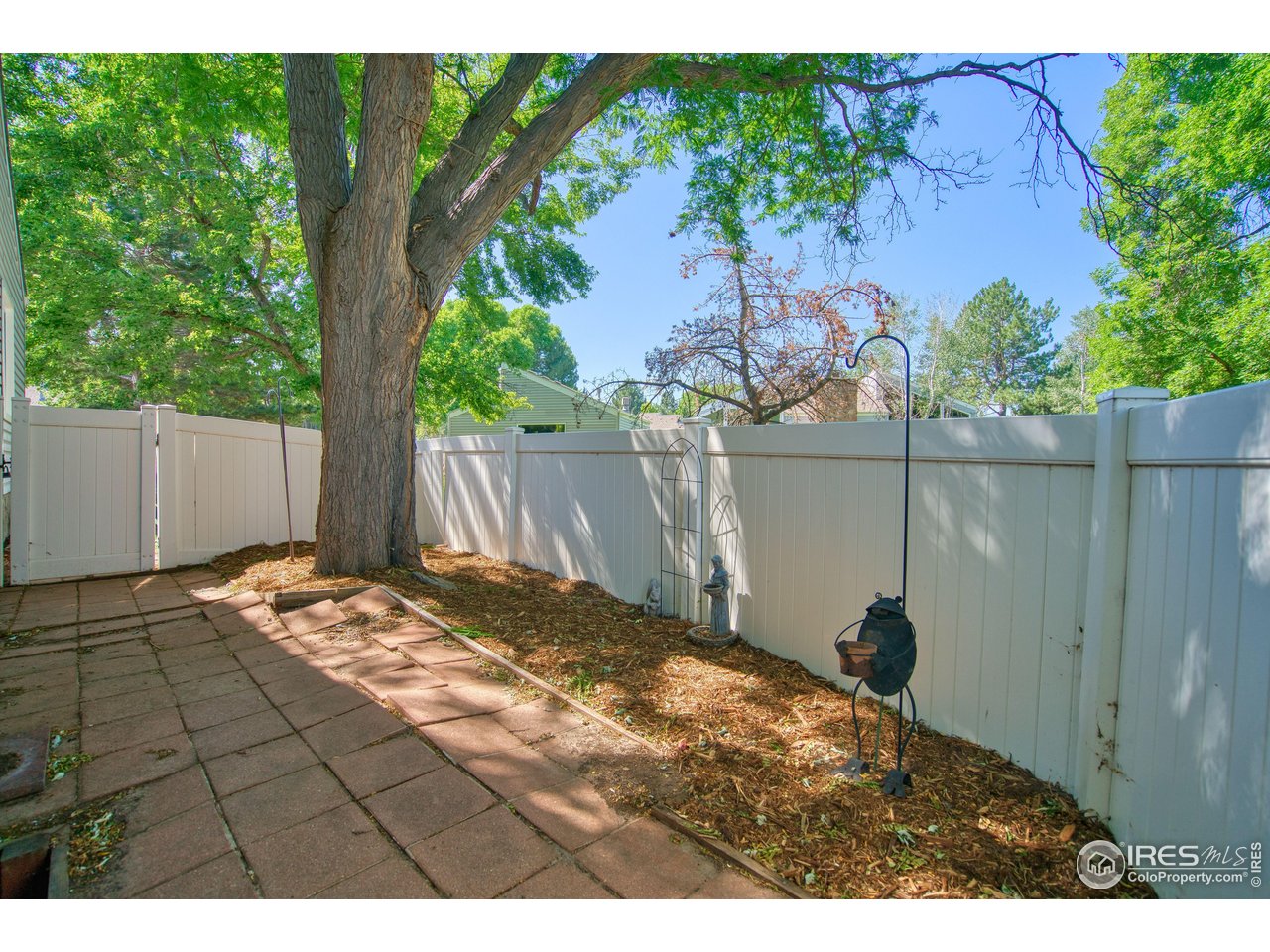 1925 28th Avenue, Unit 30 Greeley, CO 80634 - Photo 24 of 34 a backyard of a house with an outdoor space and seating area