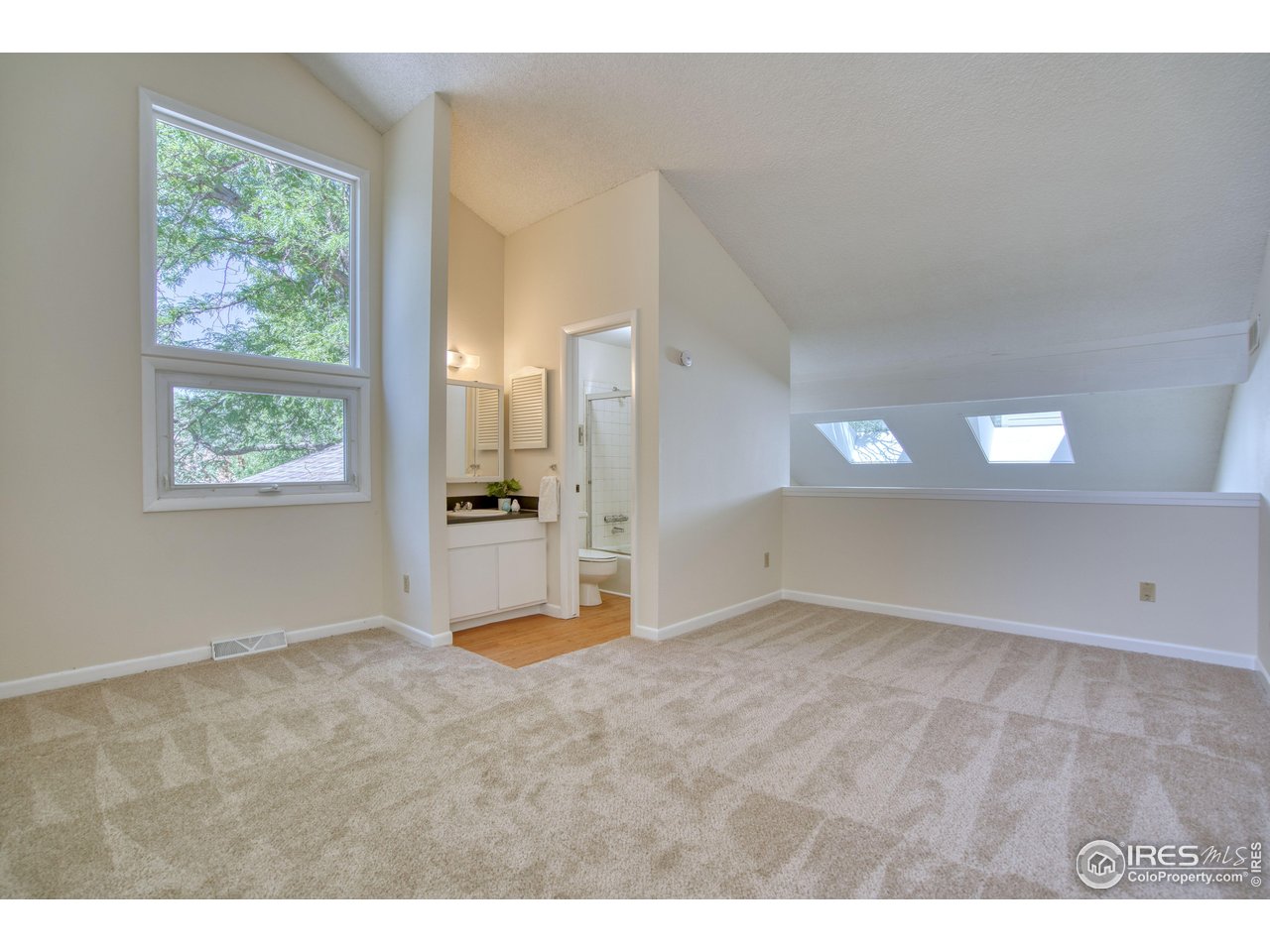 1925 28th Avenue, Unit 30 Greeley, CO 80634 - Photo 27 of 34 a view of an empty room with a window