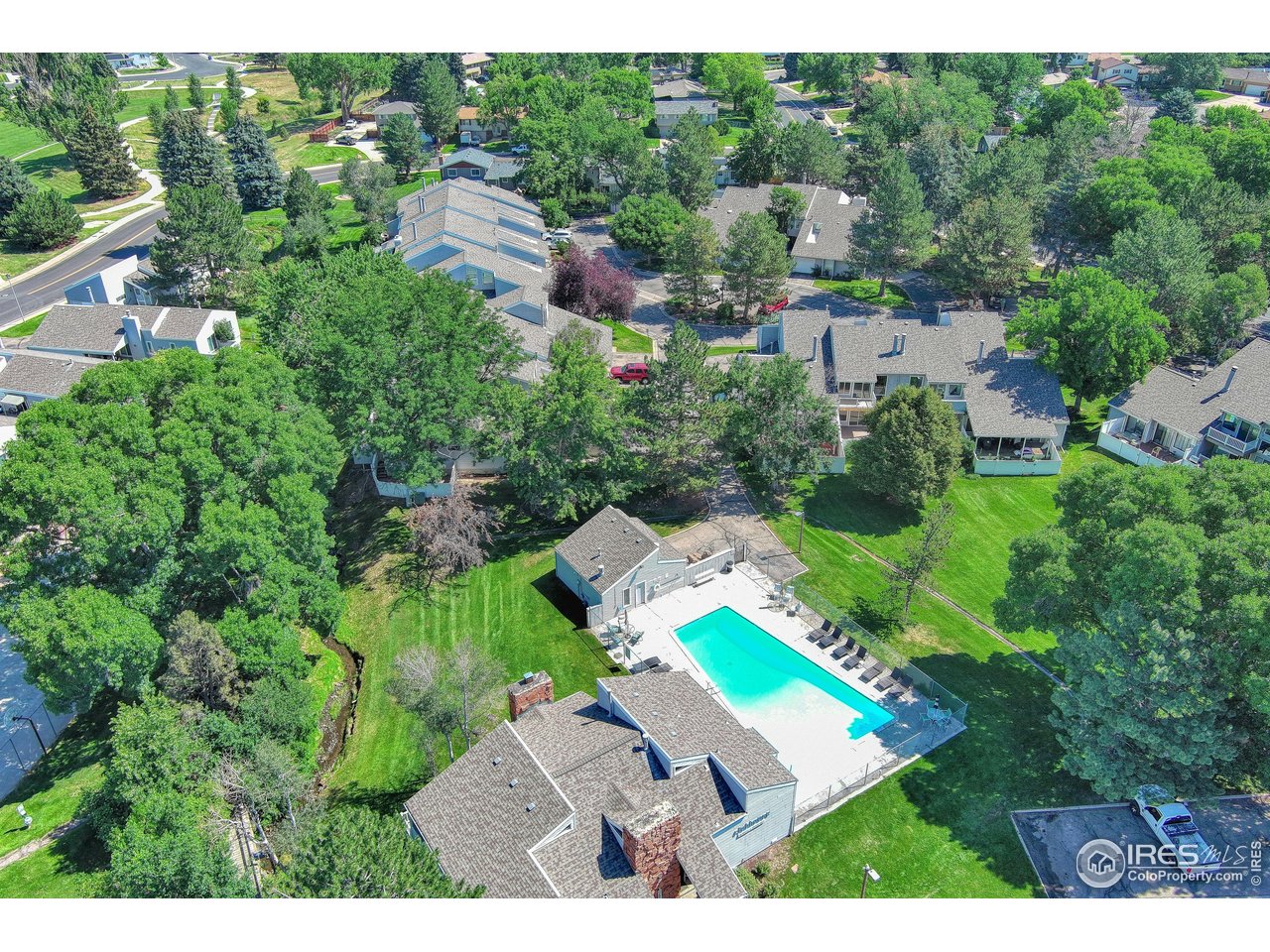1925 28th Avenue, Unit 30 Greeley, CO 80634 - Photo 4 of 34 an aerial view of a house with yard swimming pool and outdoor seating