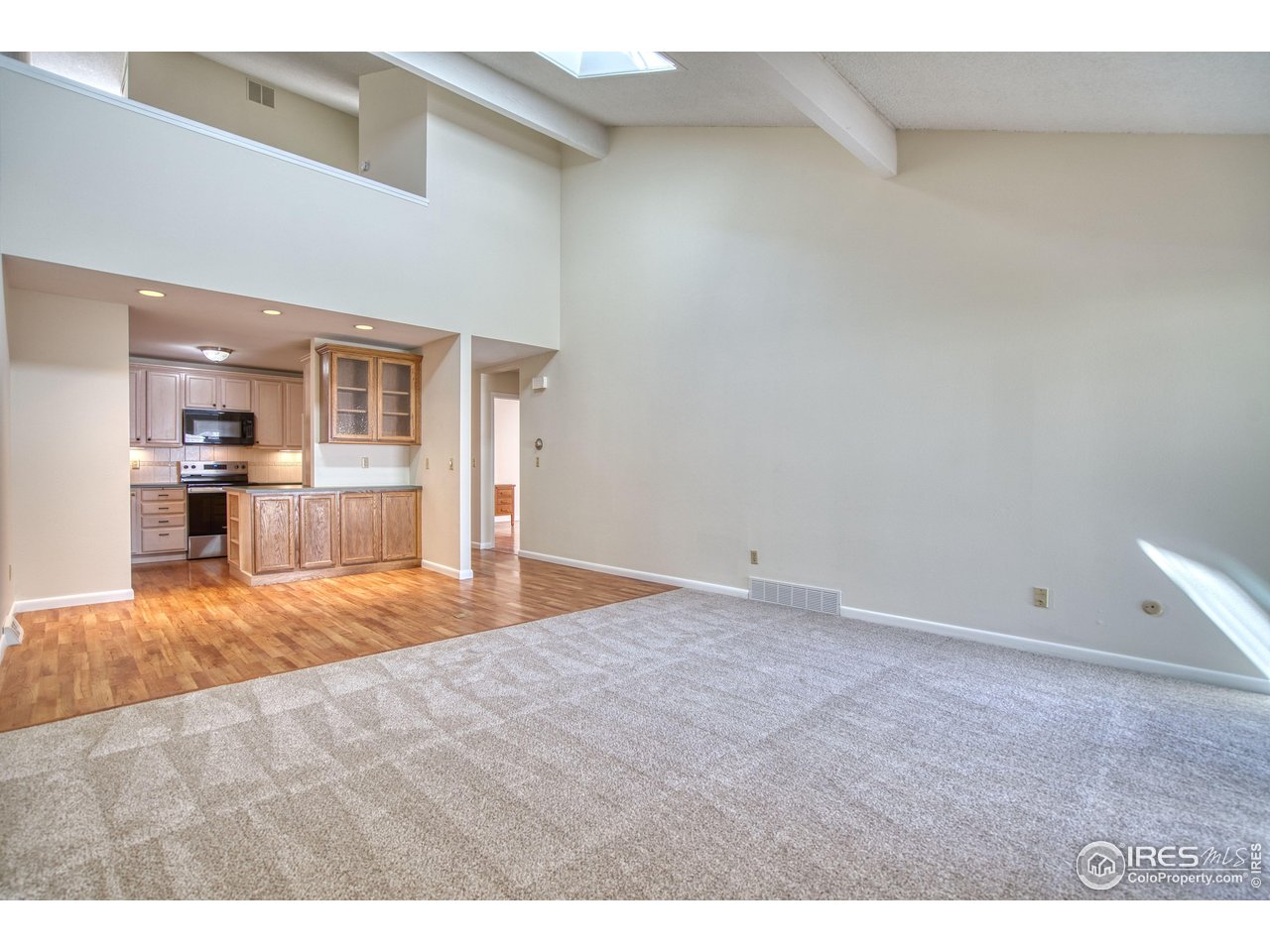 1925 28th Avenue, Unit 30 Greeley, CO 80634 - Photo 9 of 34 a view of empty room with kitchen