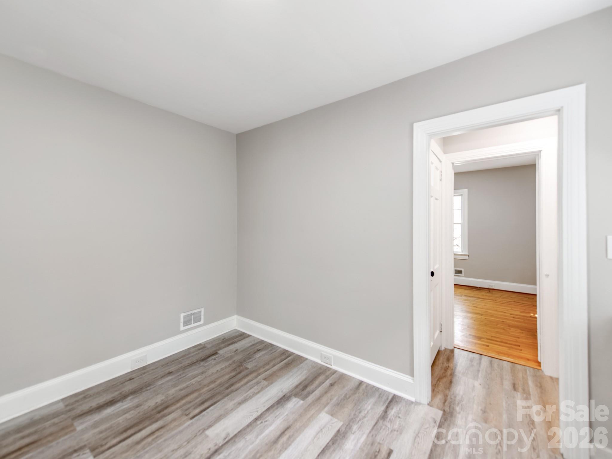 113 Falls Street Morganton, NC 28655 - Photo 10 of 33 a view of a room with wooden floor and a bathroom