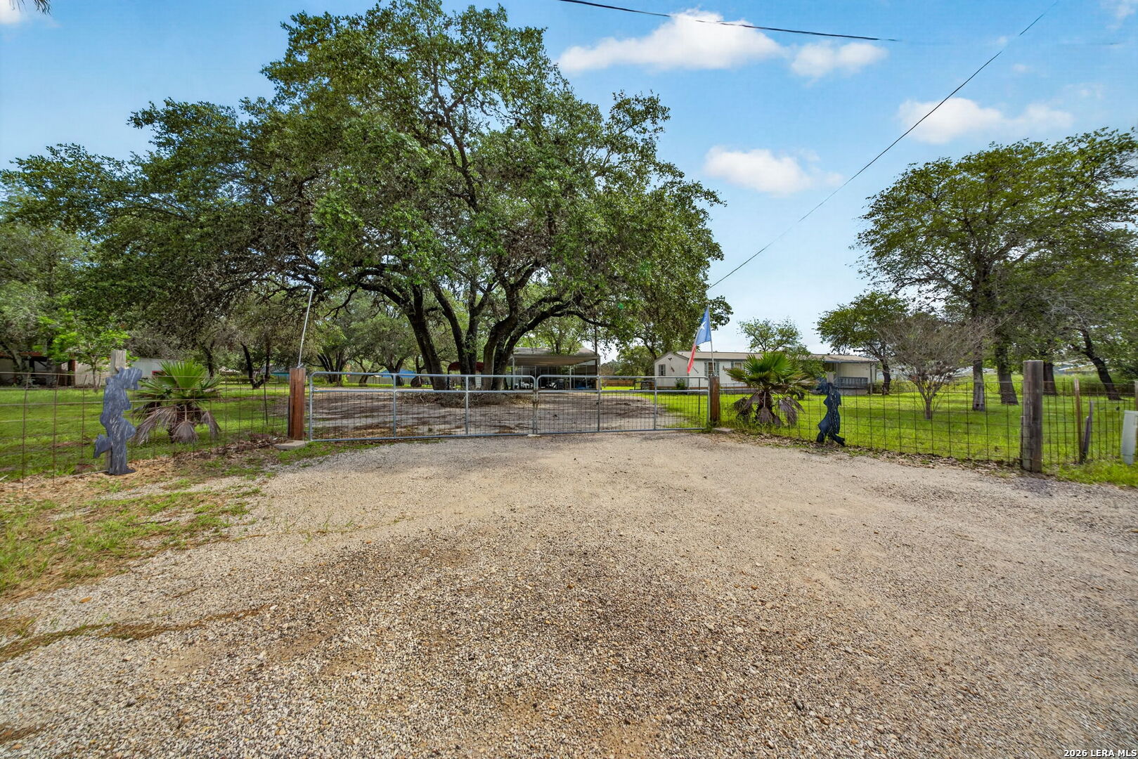 23398 Mathis Road Elmendorf, TX 78112 - Photo 2 of 18 a view of road with trees