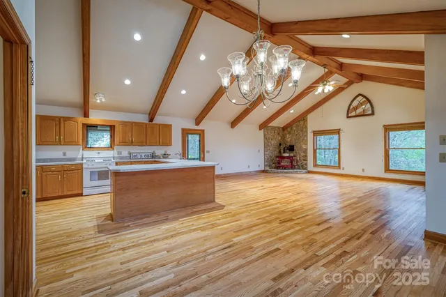a view of kitchen with cabinets and wooden floor
