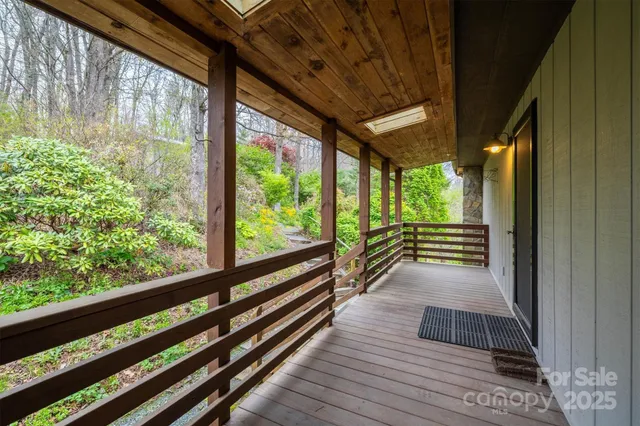 a view of balcony with wooden floor