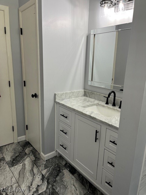 5795 Merwin Chase Road Brookfield, OH 44403 - Photo 26 of 39 Bathroom featuring vanity and marble finish flooring