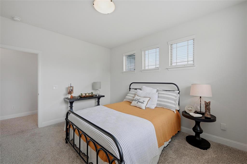 864 Shadow Valley Road Whitesboro, TX 76273 - Photo 34 of 40 Bedroom with light grey textured carpeting and white walls