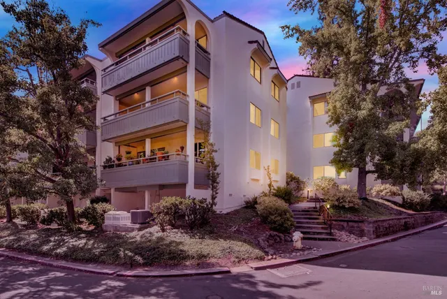 a view of a building with a yard