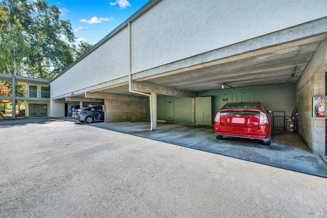 a car parked in front of garage