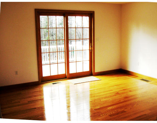 18 Minott Road Westminster, MA 01473 - Photo 5 of 9 a view of an empty room with wooden floor and a window