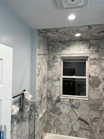 a living room with a fireplace and a fireplace