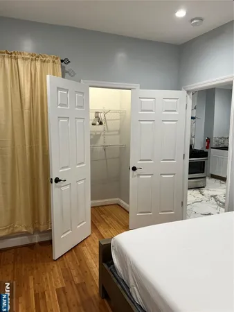 a bedroom with a bed and a dresser