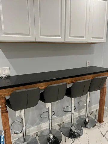 a kitchen with a table and chairs