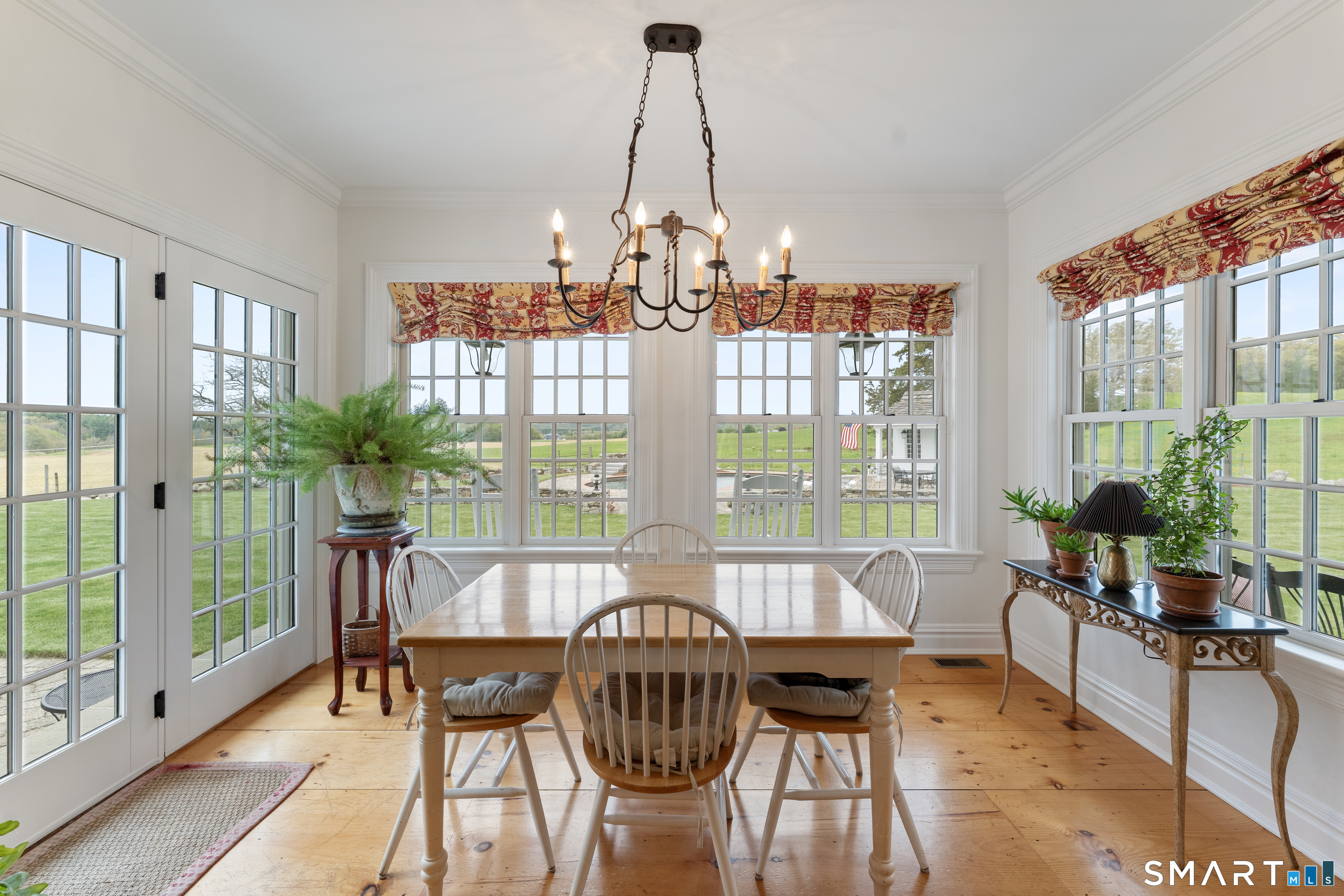 155 Paine Road Woodstock, CT 06281 - Photo 8 of 40 a view of a dining room with furniture window and wooden floor
