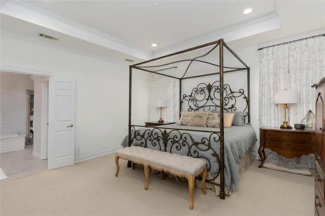 a bedroom with furniture and a window