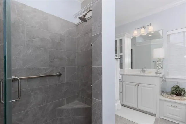 a bathroom with a shower and a sink