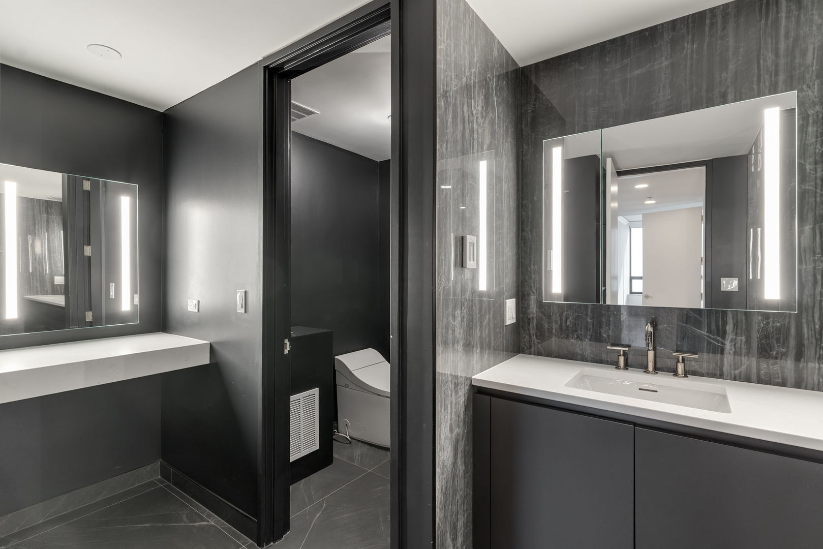 180 East Pearson Street, Unit 3502 Chicago, IL 60611 - Photo 18 of 33 a bathroom with a double vanity sink and mirror