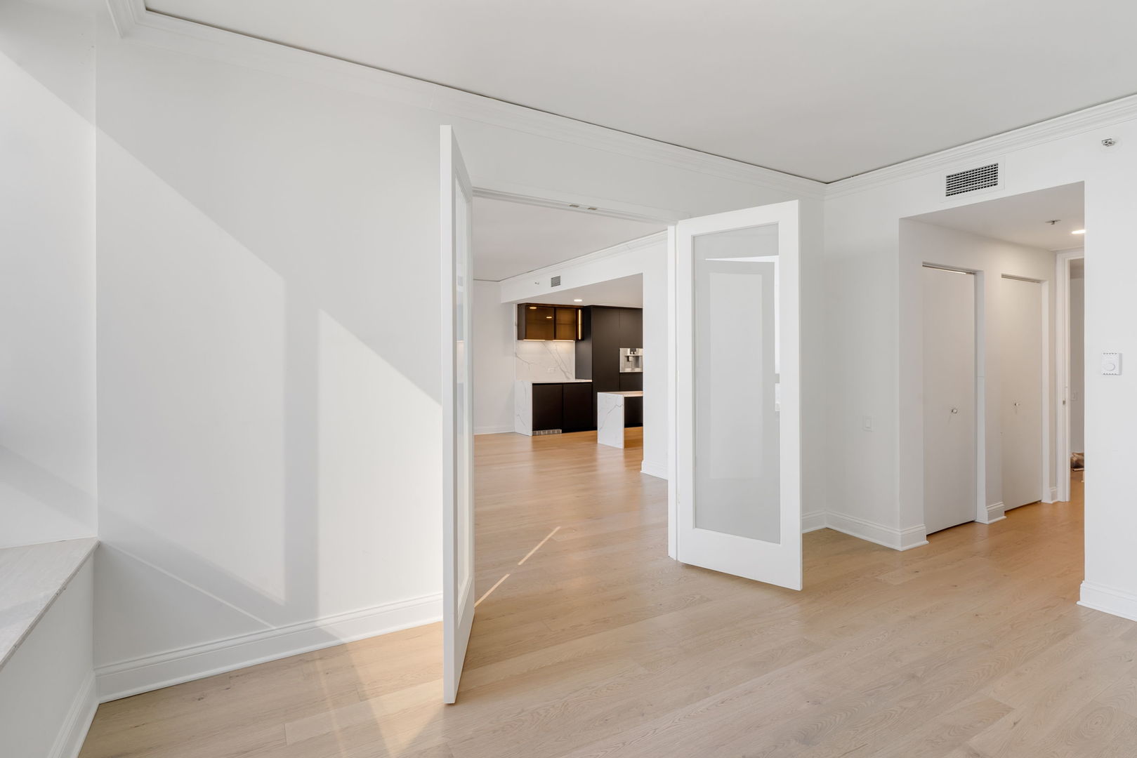 180 East Pearson Street, Unit 3502 Chicago, IL 60611 - Photo 21 of 33 a view of a hallway with wooden shelves