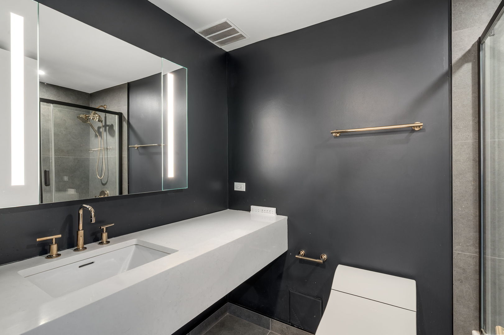 180 East Pearson Street, Unit 3502 Chicago, IL 60611 - Photo 22 of 33 a bathroom with a sink and a mirror