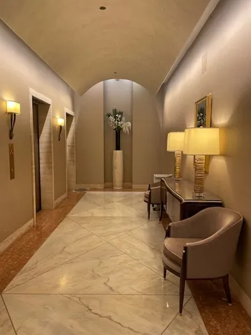a view of a patio with couches table and chairs and potted plants
