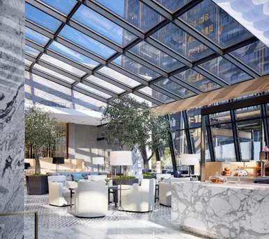 a living room with fireplace furniture and a potted plant