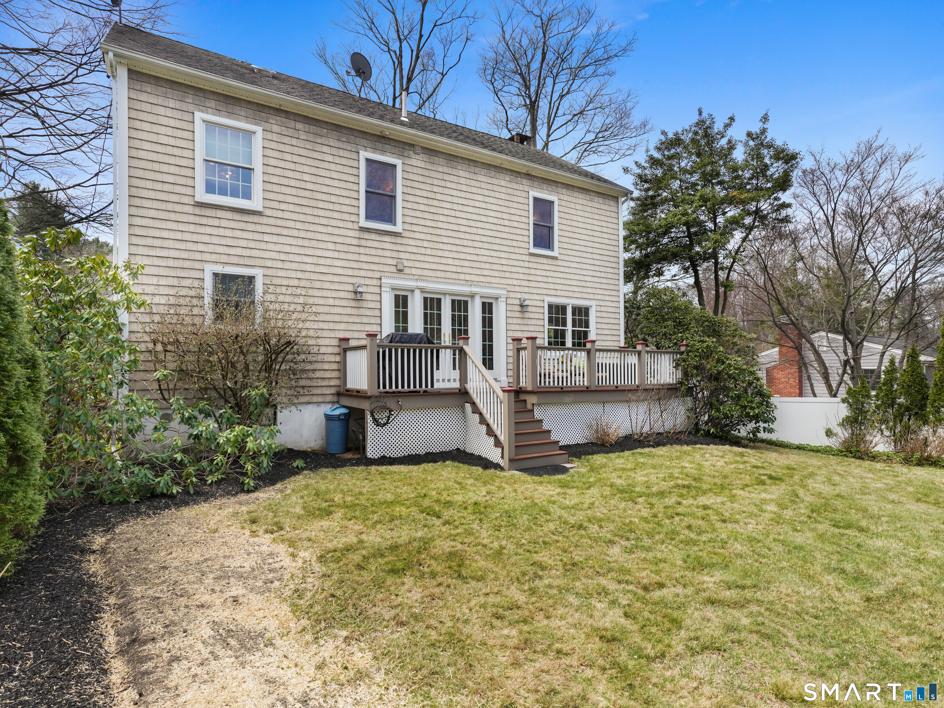 82 Ramapoo Road Ridgefield, CT 06877 - Photo 34 of 40 a view of a house with a yard and sitting area