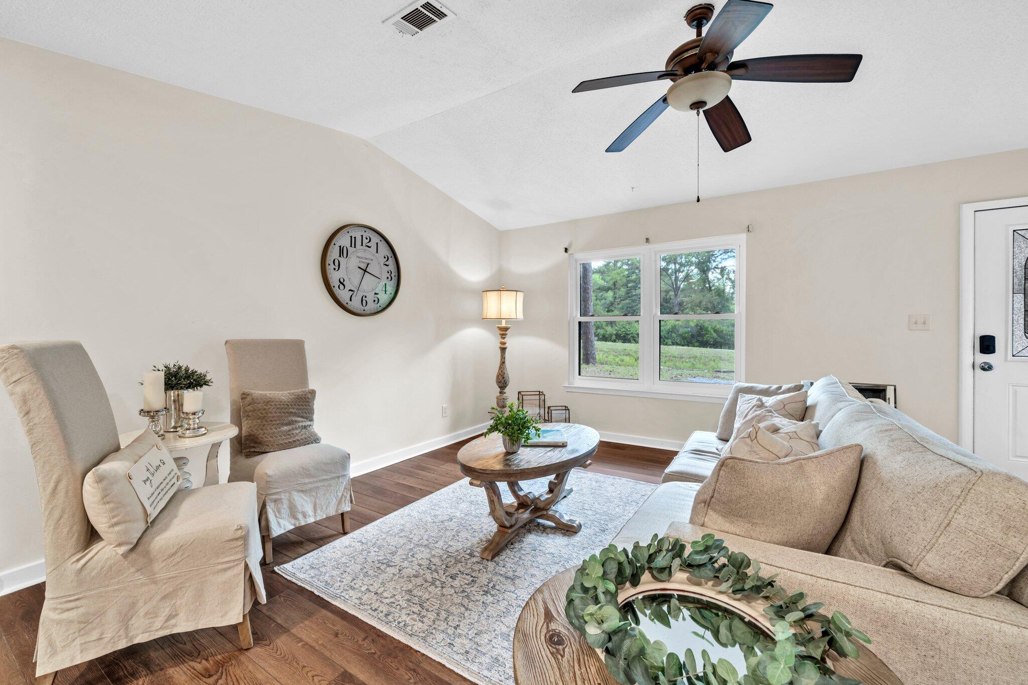 5241 Bob Sikes Road DeFuniak Springs, FL 32435 - Photo 12 of 35 a living room with furniture and a window