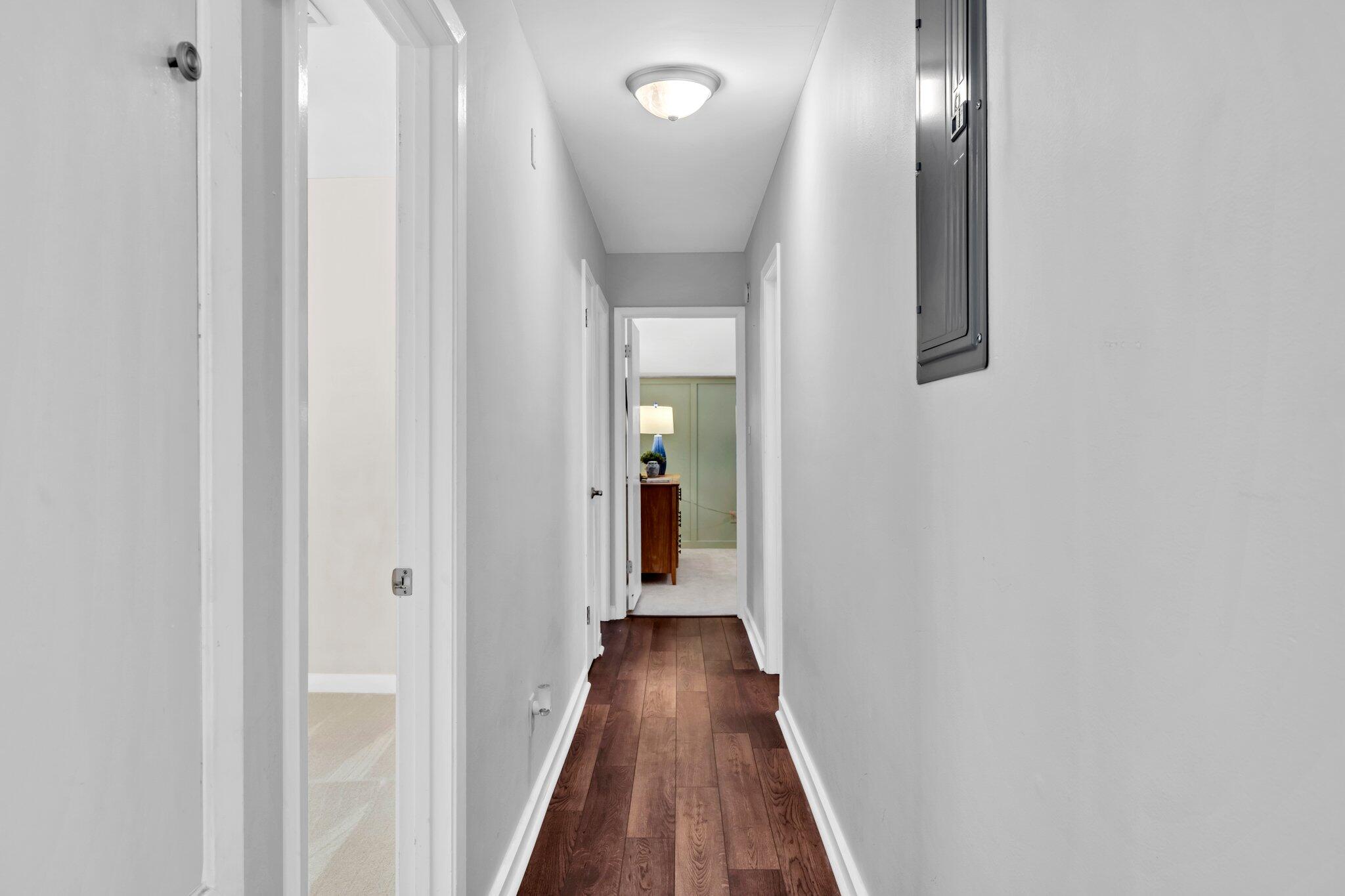 5241 Bob Sikes Road DeFuniak Springs, FL 32435 - Photo 18 of 35 a view of a hallway with wooden floor