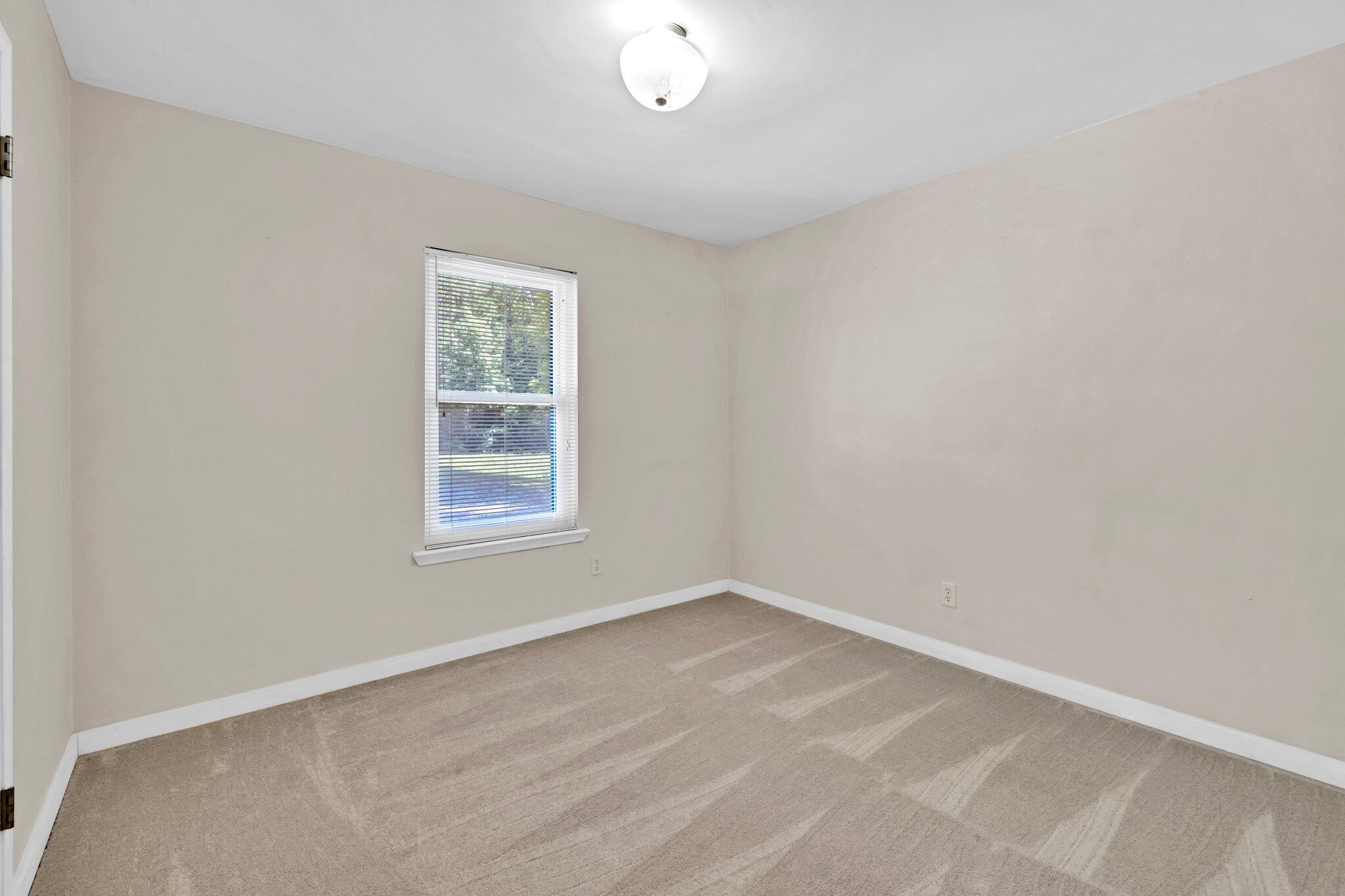 5241 Bob Sikes Road DeFuniak Springs, FL 32435 - Photo 19 of 35 an empty room with a window
