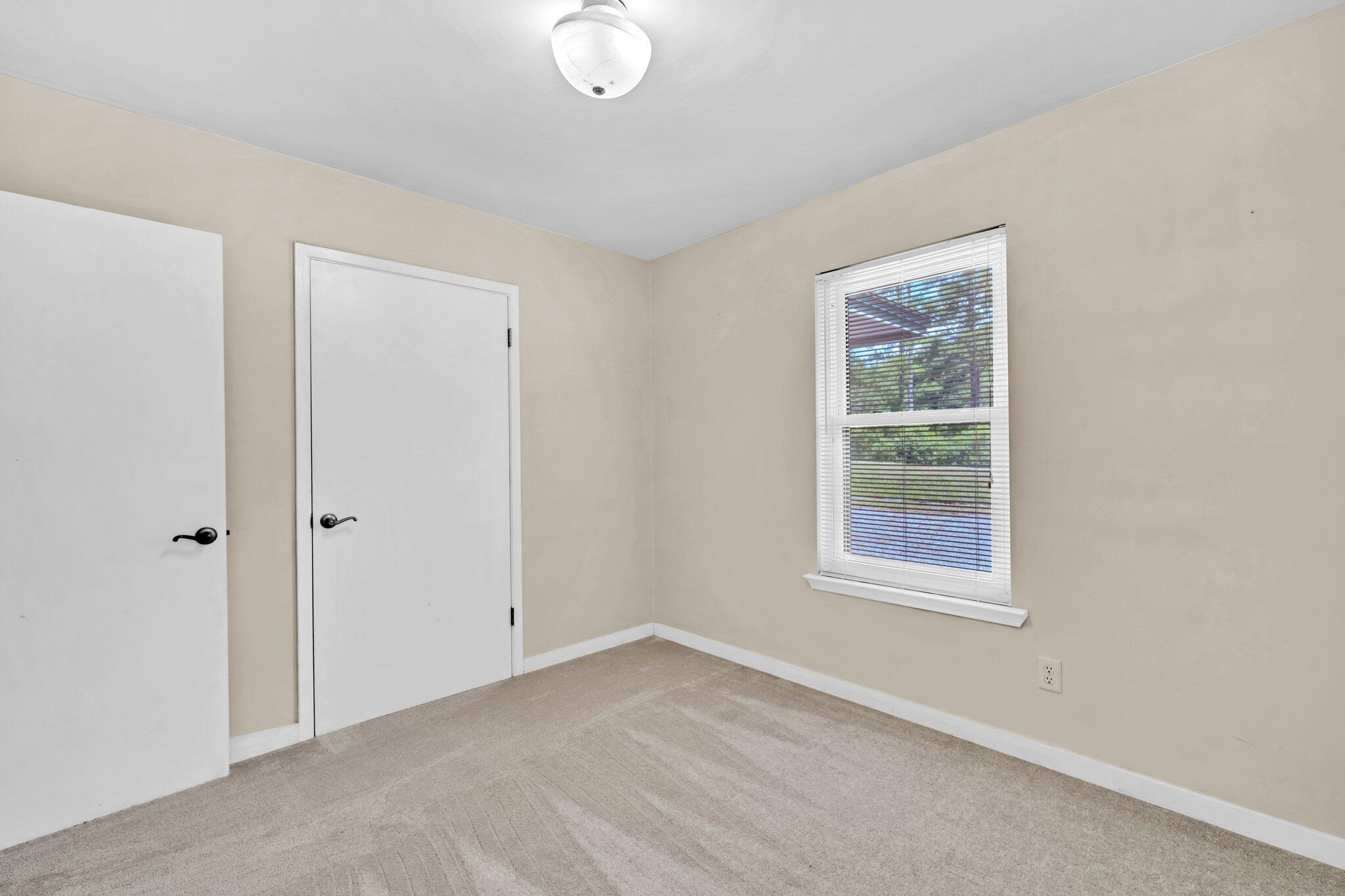 5241 Bob Sikes Road DeFuniak Springs, FL 32435 - Photo 20 of 35 an empty room with windows
