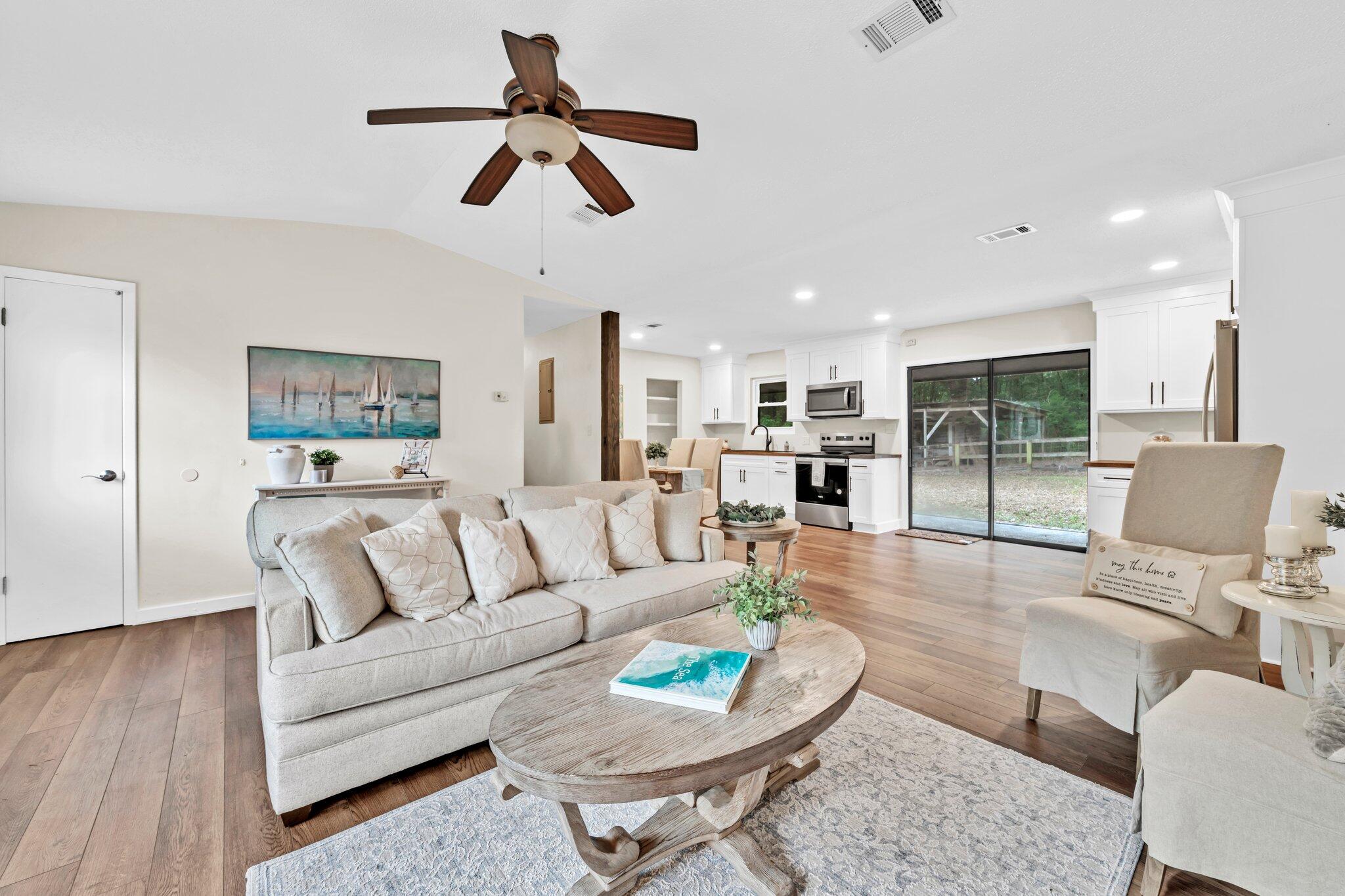 5241 Bob Sikes Road DeFuniak Springs, FL 32435 - Photo 2 of 35 a living room with furniture and a large window