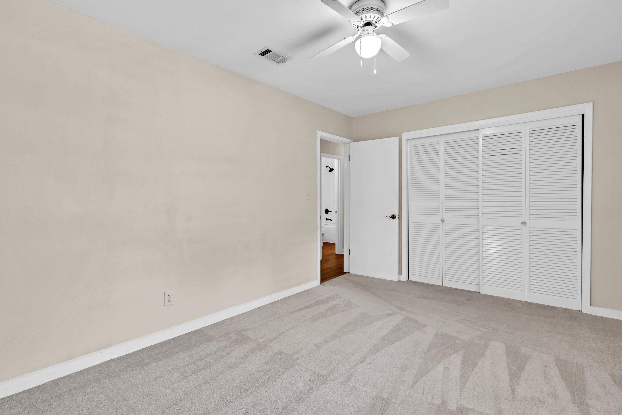 5241 Bob Sikes Road DeFuniak Springs, FL 32435 - Photo 22 of 35 a view of an empty room with a ceiling fan