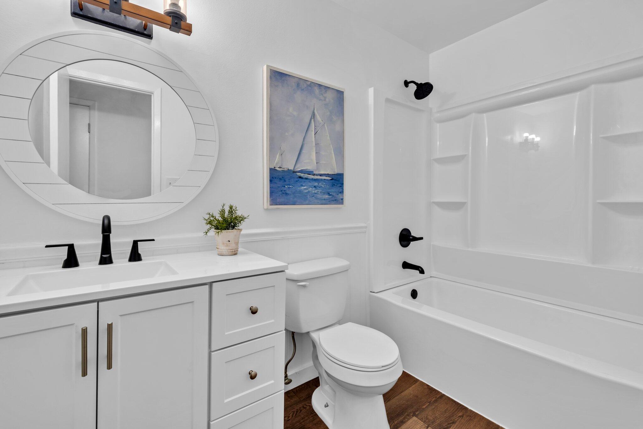 5241 Bob Sikes Road DeFuniak Springs, FL 32435 - Photo 27 of 35 a bathroom with a sink a toilet and shower
