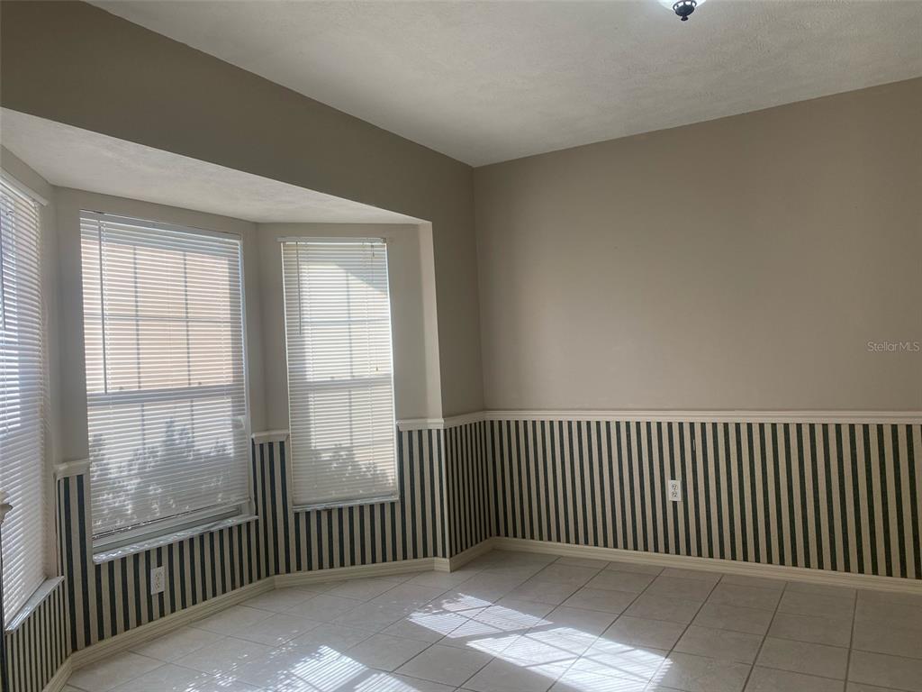 5881 Southwest 86th Place Ocala, FL 34476 - Photo 11 of 18 a view of a room with wooden floor