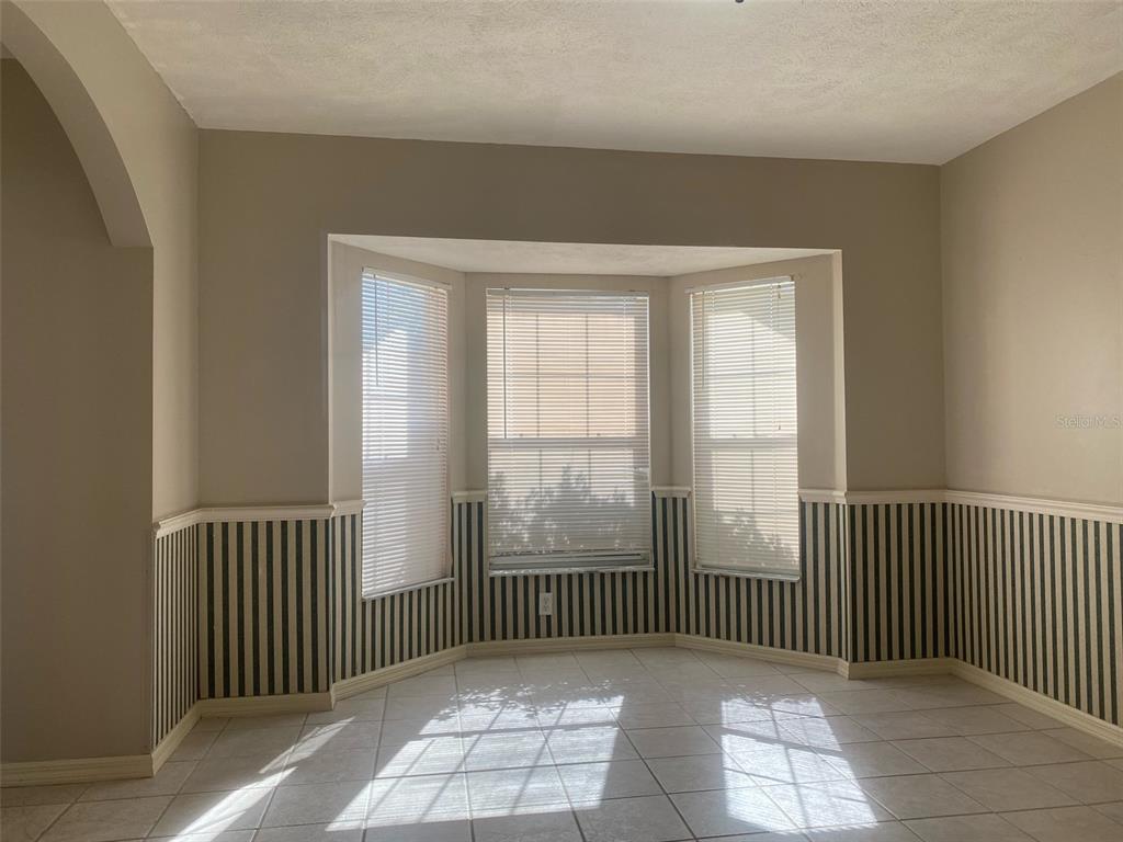 5881 Southwest 86th Place Ocala, FL 34476 - Photo 12 of 18 a view of a room with windows