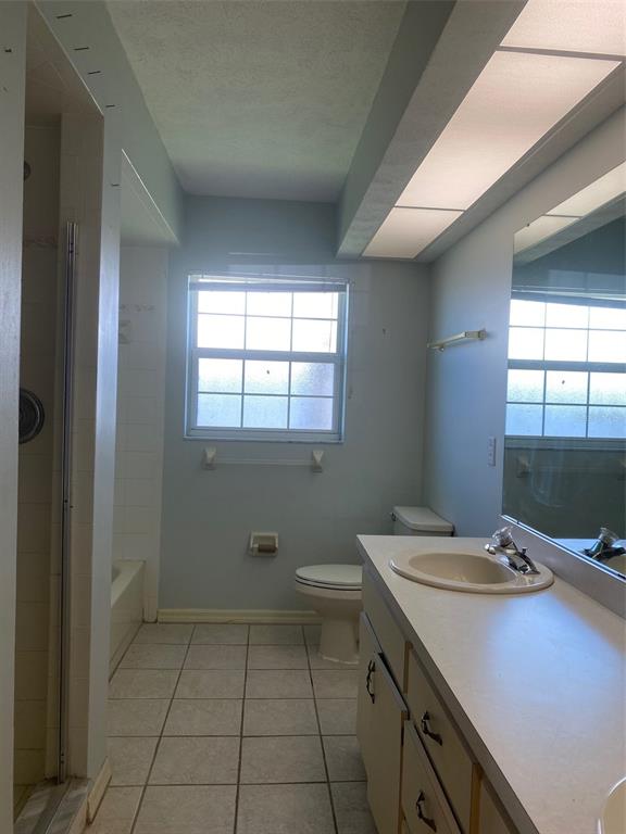 5881 Southwest 86th Place Ocala, FL 34476 - Photo 15 of 18 a bathroom with a sink toilet and window