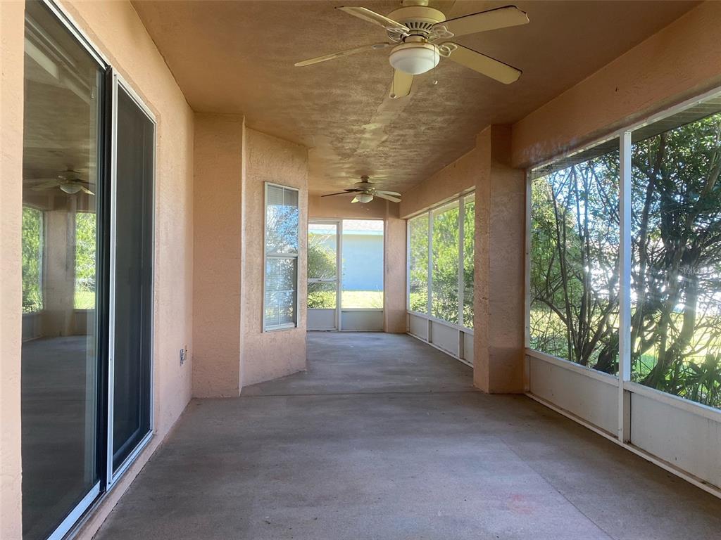 5881 Southwest 86th Place Ocala, FL 34476 - Photo 6 of 18 a view of a room with windows and ceiling fan