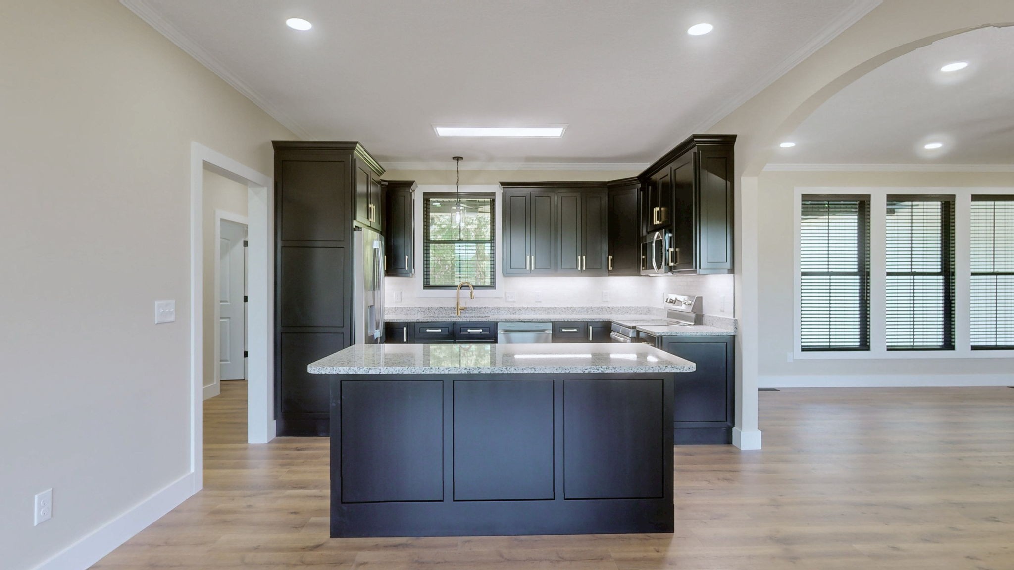 865 Alman Cemetery Road Paris, TN 38242 - Photo 7 of 41 a dining hall with stainless steel appliances granite countertop a sink a counter space and a window