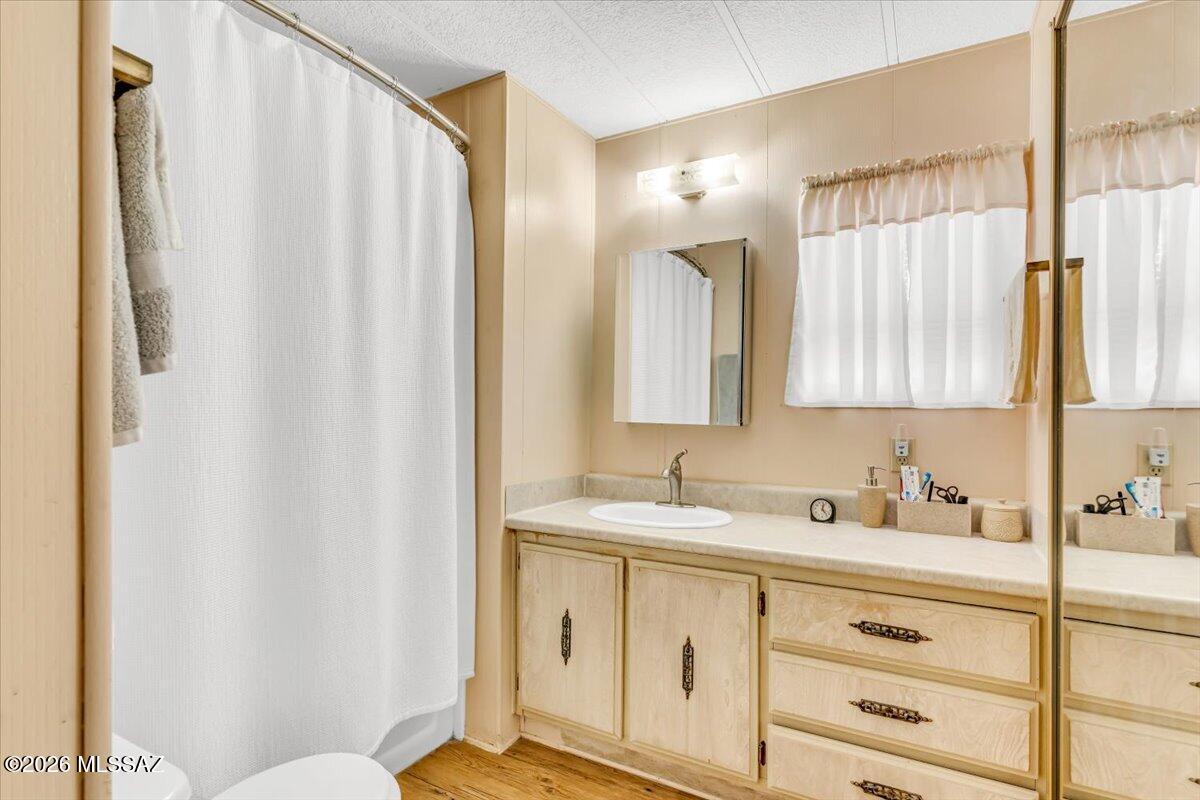 5379 West Rafter Cir Street Tucson, AZ 85713 - Photo 21 of 38 a bathroom with a sink and a mirror