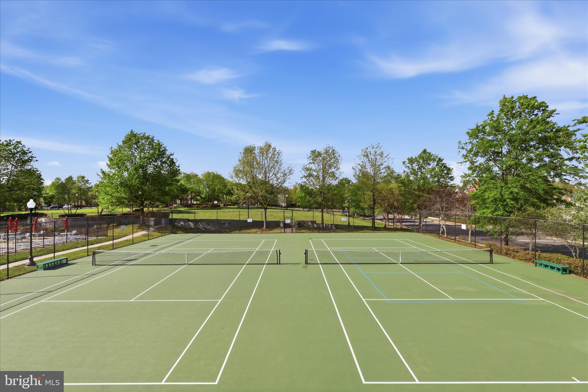 25352 Ripleys Field Drive Chantilly, VA 20152 - Photo 42 of 54 a tennis court with view of trees in the background