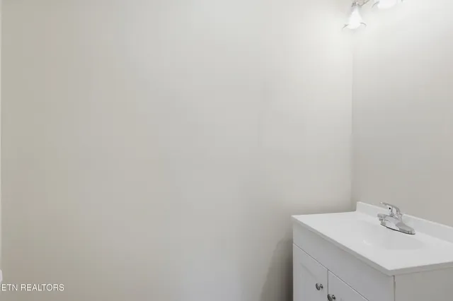 a bathroom with a sink and vanity
