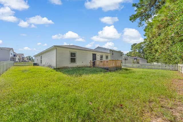 a view of a house with a big yard